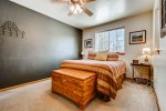 Master bedroom with king bed and ceiling fan for summer nights 